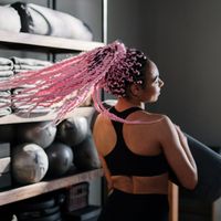 Professional female yoga instructor smiling calmly